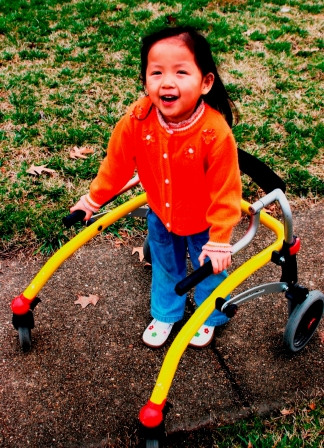 Little girl using walker