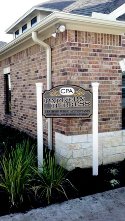 C12003 - CPA Sign Installed with Wood Posts outside Building