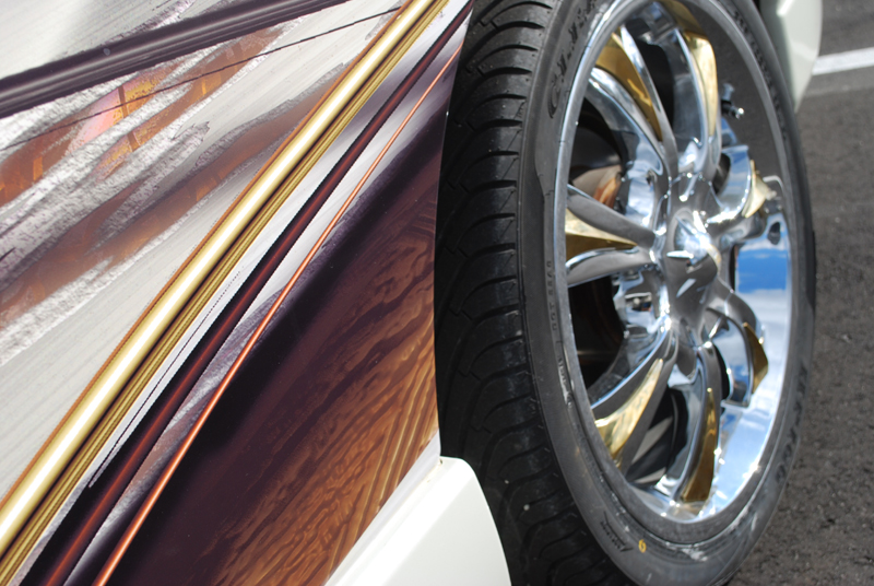  VEHICLE WRAP- CLOSE UP OF DETAIL WRAP TO RIM- CUSTOM