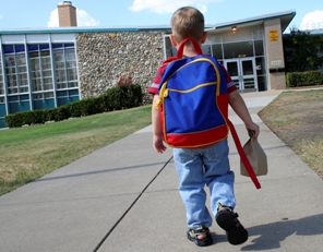 Young boy heading to School