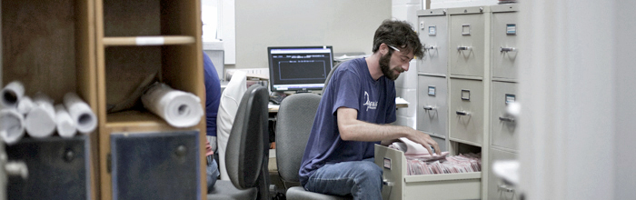 Employee Looking in Filing Cabinet