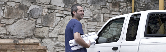Employee Carrying Plans to Truck