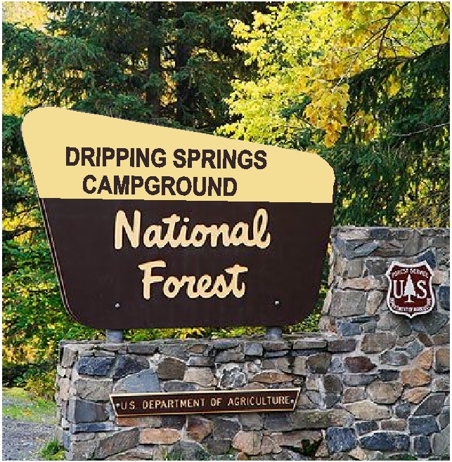 M6490 - Wood Sign supported by Steel Posts with surrounding Stone Monument