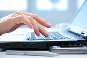 typing on laptop