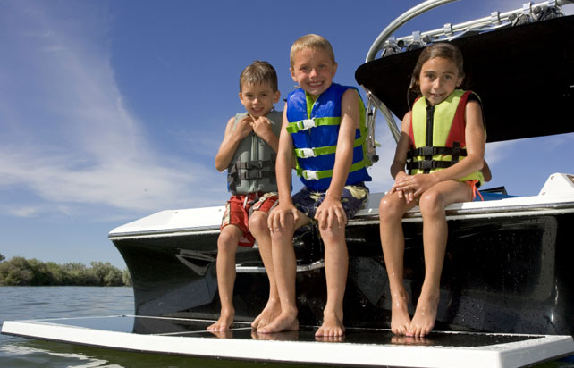 Three children on a boat
