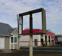 Existing broken sagging sign