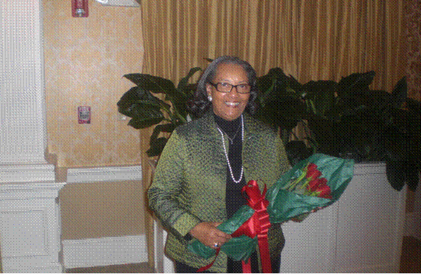 Jane Spann was presented roses at Annual Luncheon