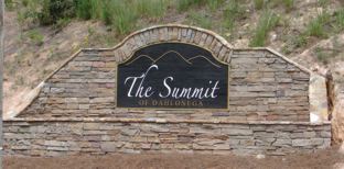 Sandblasted Sign With Stacked Rock Surround