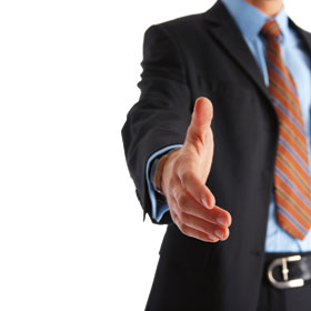 Man in suit shaking hands