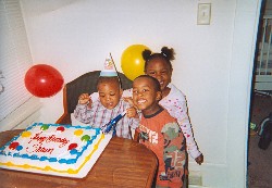 Tyanna's youngest, Deshawn, celebrates his 2nd birthday with brother, Tyjhir, and Beth Shalom neighbor, Shamya