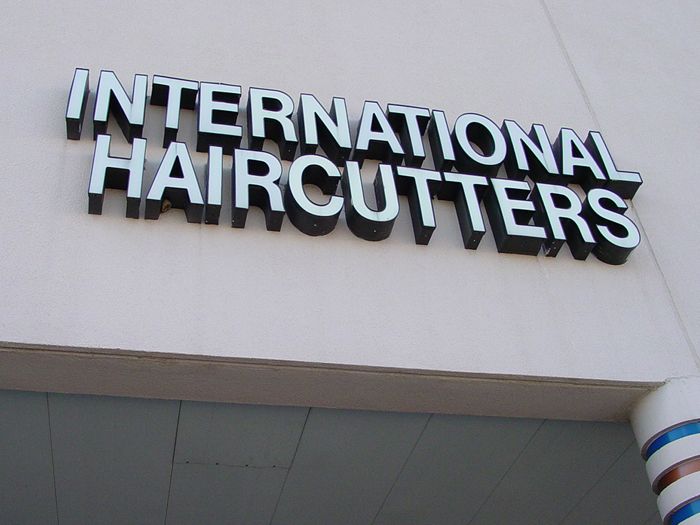 International Haircutters Storefront Sign
