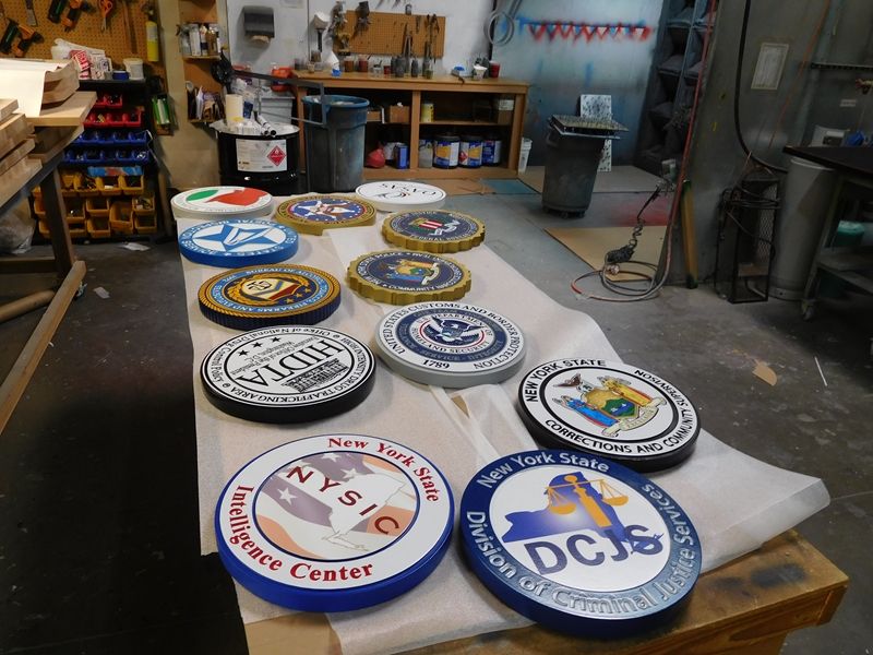 W32600 - Photo of Some of Our Wall Plaques Near Completion in Our Paint Shop