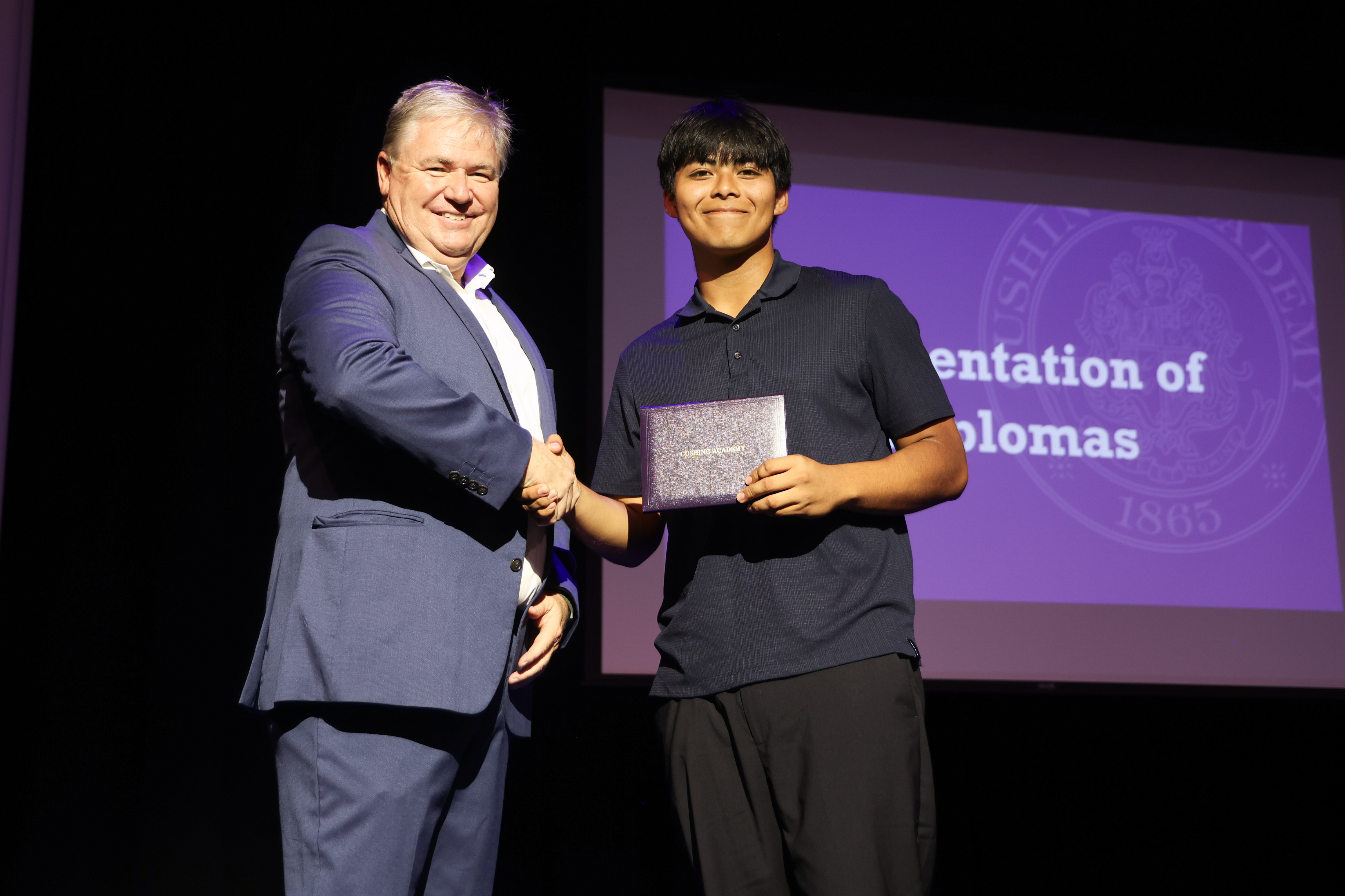 Alex is presented with his certificate after completing Cushing Academy's Summer Program.