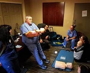 Nurses practicing CPR.