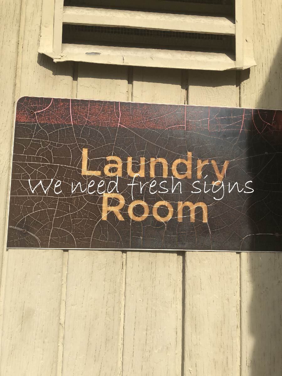 Old cracked sign needs replacement