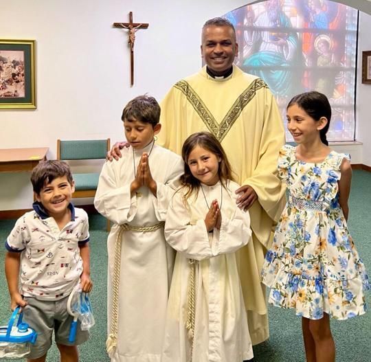 Priest and children