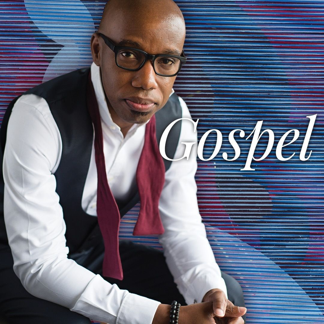 Guest Conductor Jason Max Ferdinand is pictured in front of a blue and purple decorative background with the word "Gospel" superimposed over the image.