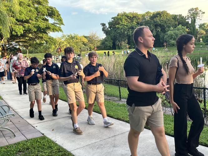 People of all ages walk around the pond at Emmanuel Parish while praying the rosary during the Steps for Life event Sept. 27, 2025.