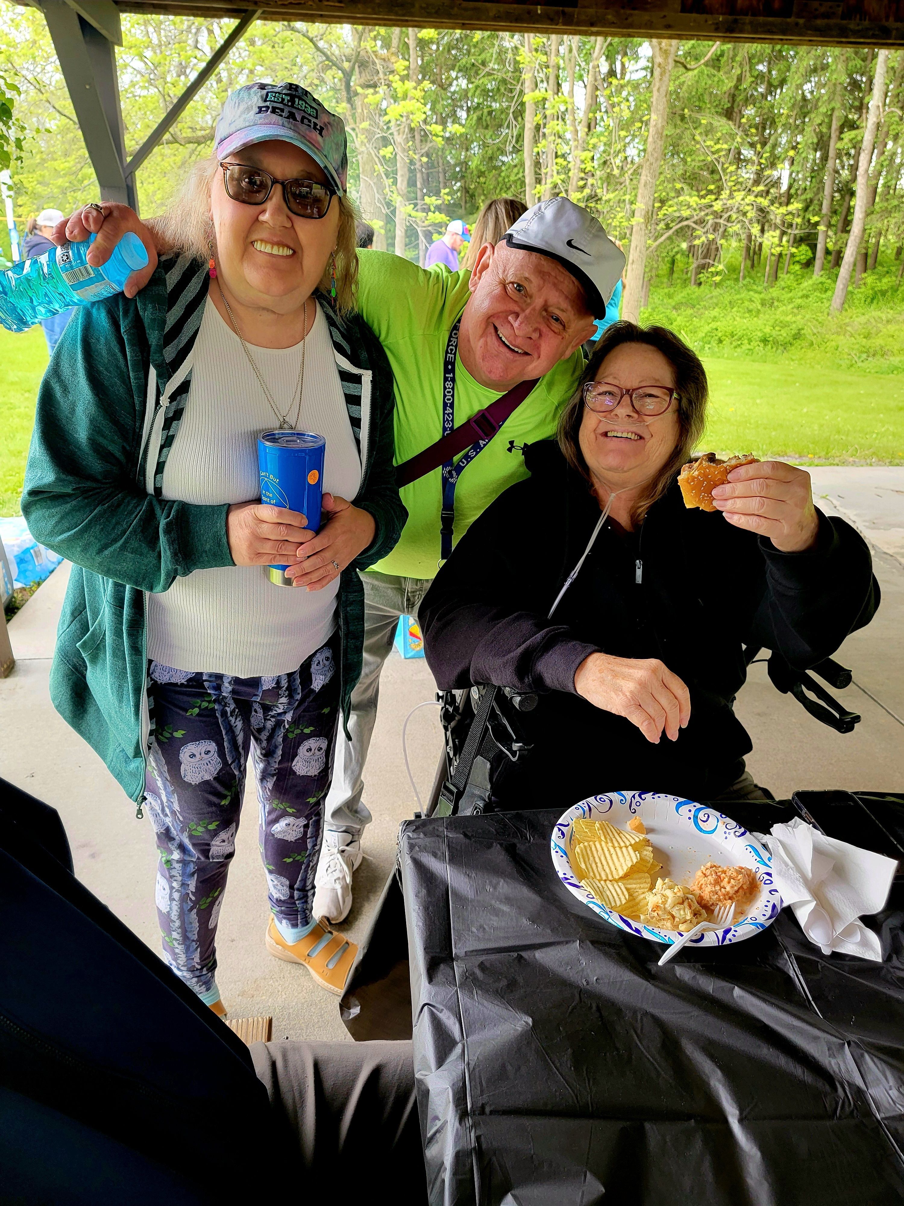 Group of three in pavilion Hamburger Day