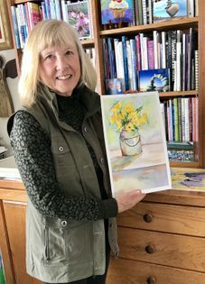 Artist Barb Ross with watercolor painting