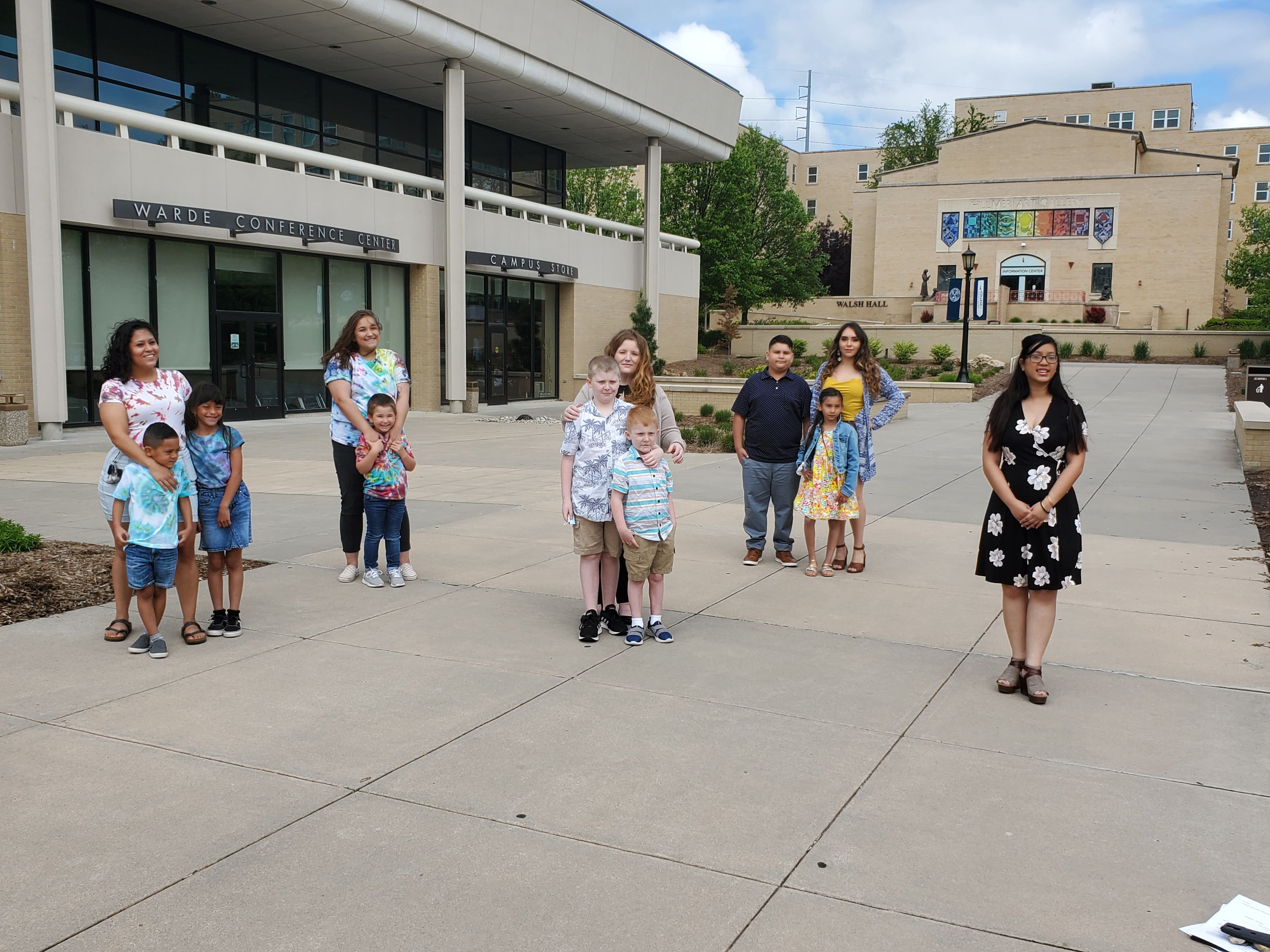 Christ Child Society scholars stand with their children.