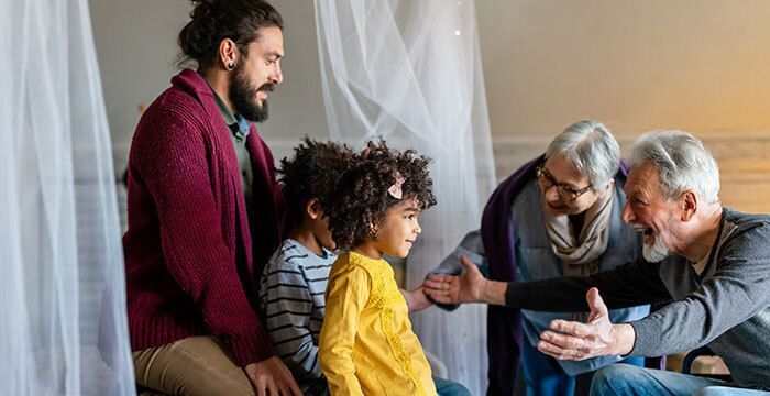 Family visiting grandparents in retirement home