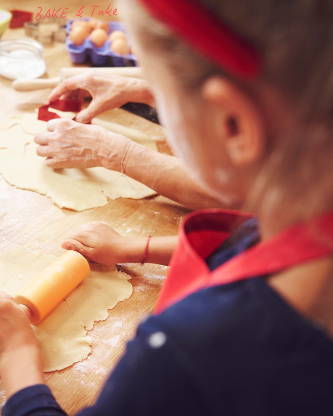 Girl rolling out dough with adult in the background