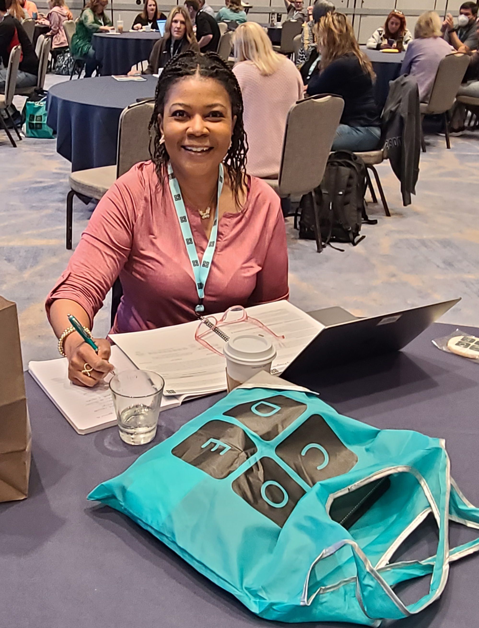 Jacqueline Edwards seated at a conference table at the recent Code.org facilitator training in Minneapolis, MN.