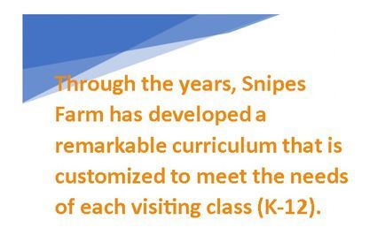 A sign says "Through the years, Snipes Farm has developed a remarkable curriculum that is customized to meet the needs of each visiting class."