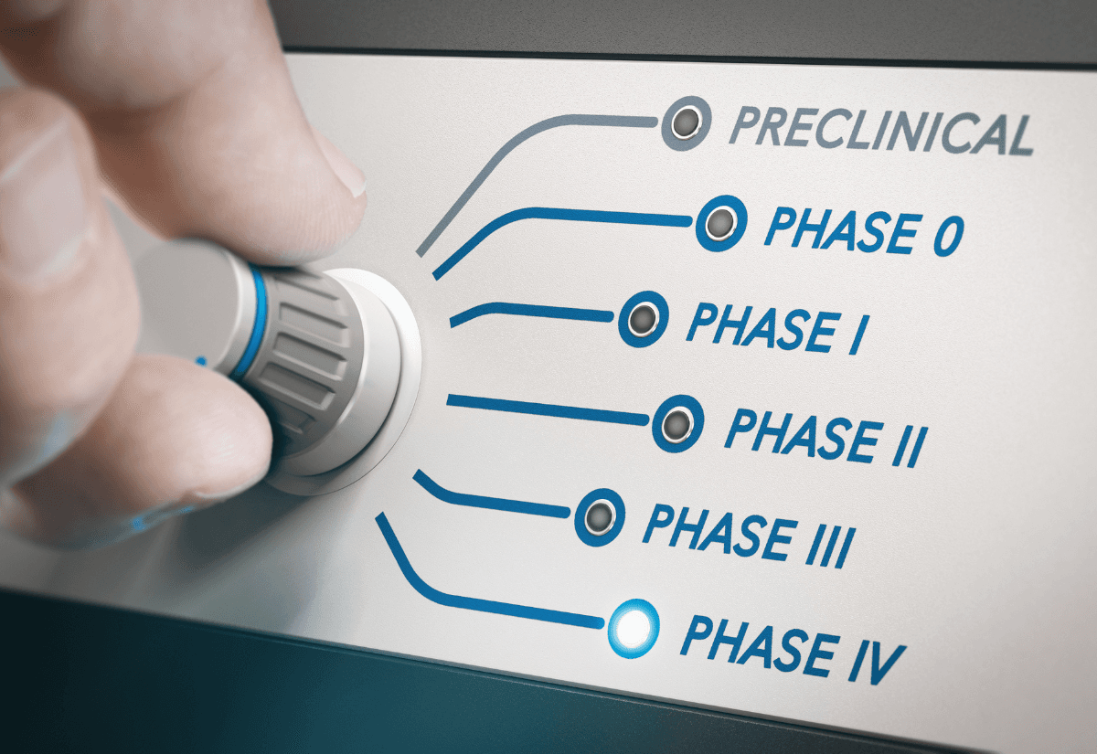 Hand turning knob to select phases of clinical trial. Focus on phase IV