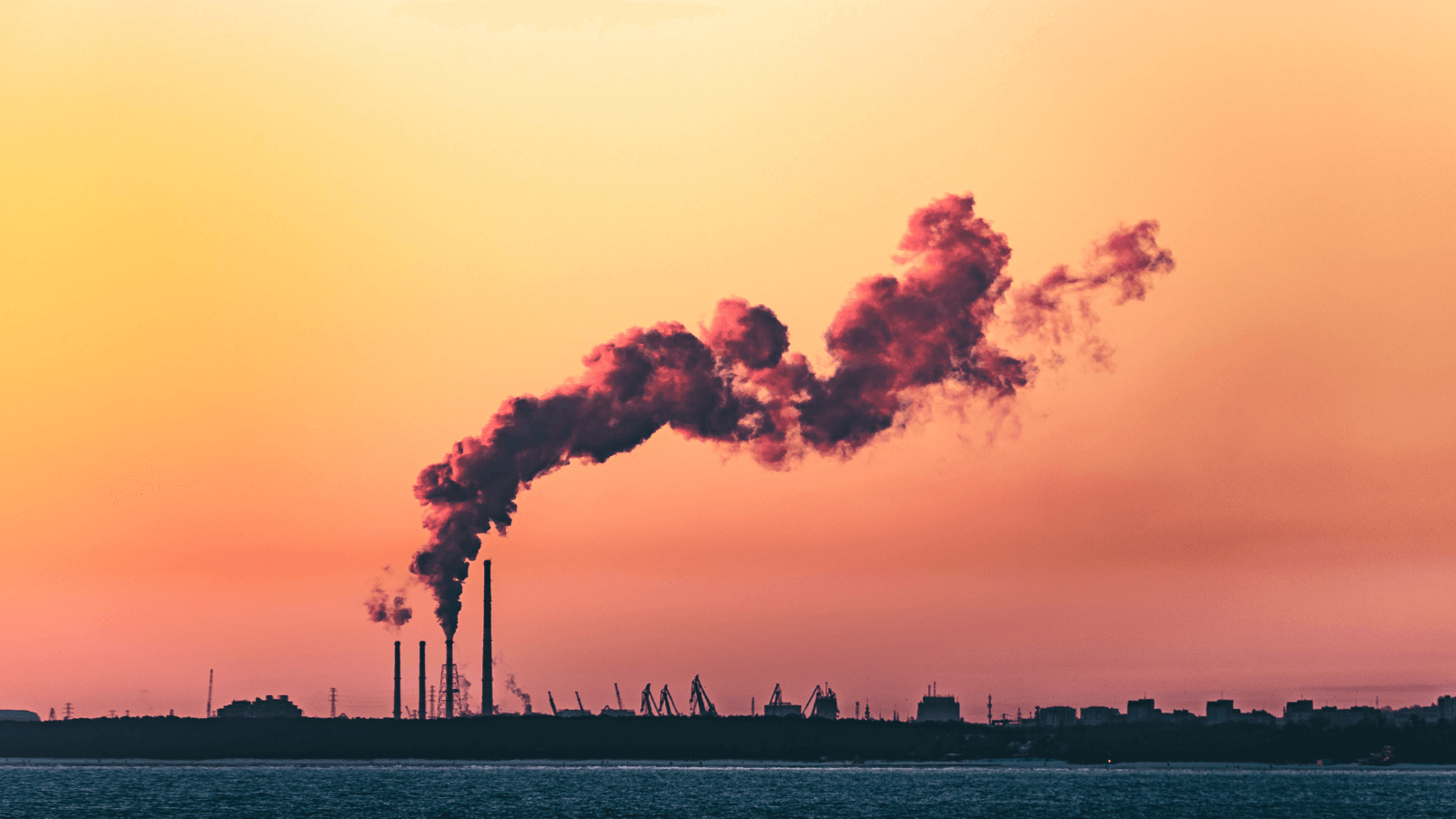 Power plant emitting pollution next to ocean