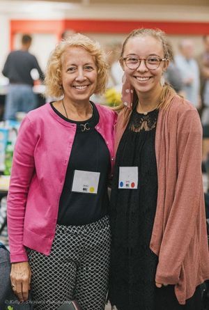 A mom and daughter are smiling together while attending a PSC Partners conference.