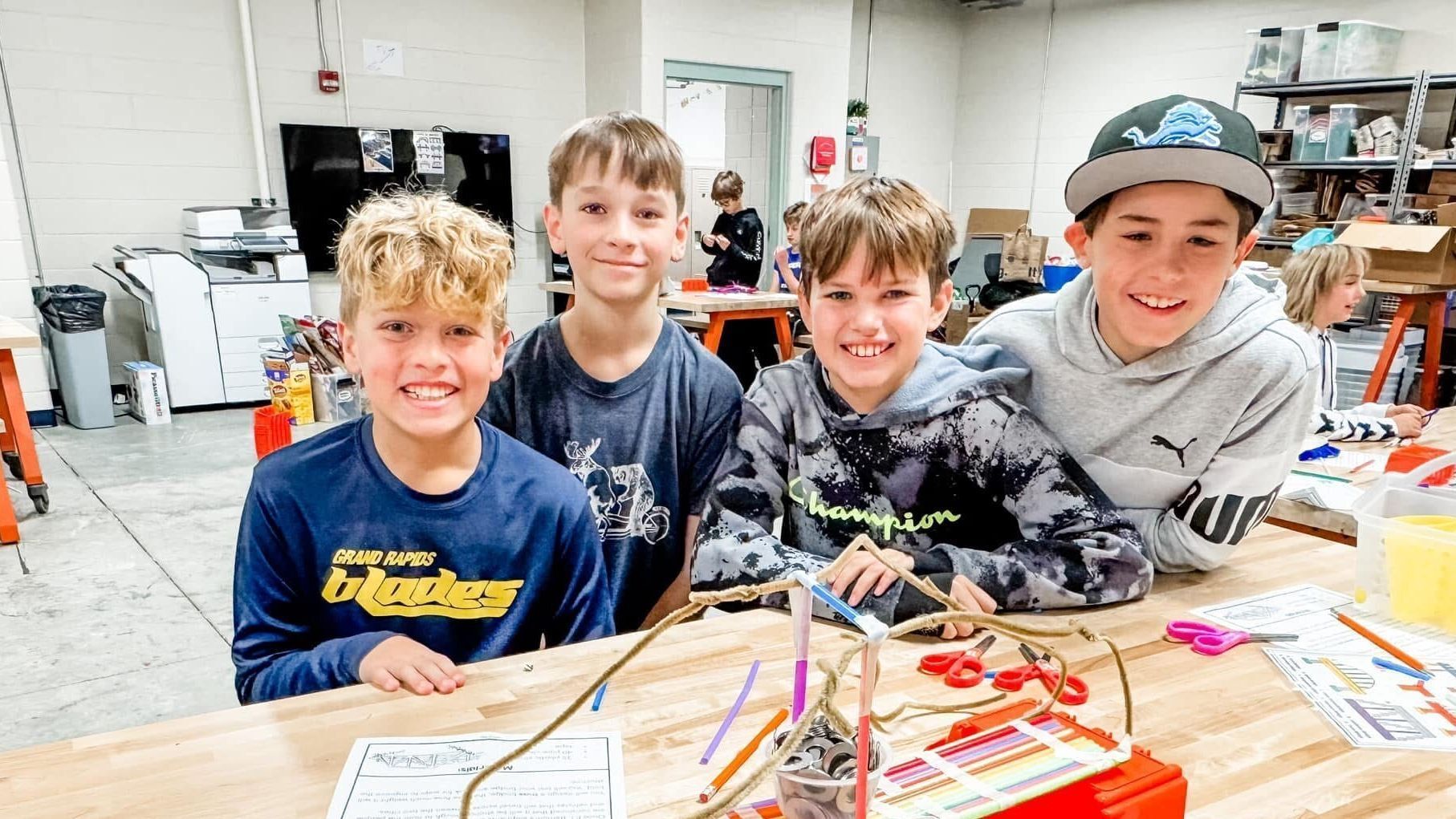 Four boys working together in a STEAM classroom at Edgerton Trails Elementary