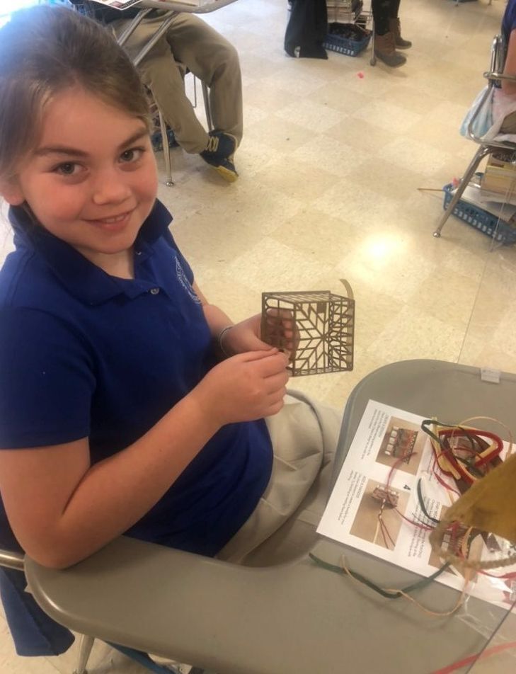 Student making craft basket