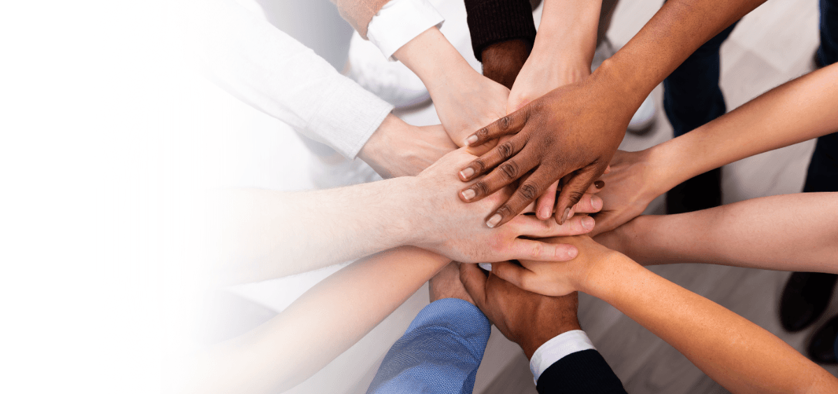 Logo of Consumers for Affordable Health Care projected into the sky from Pemaquid Lighthouse