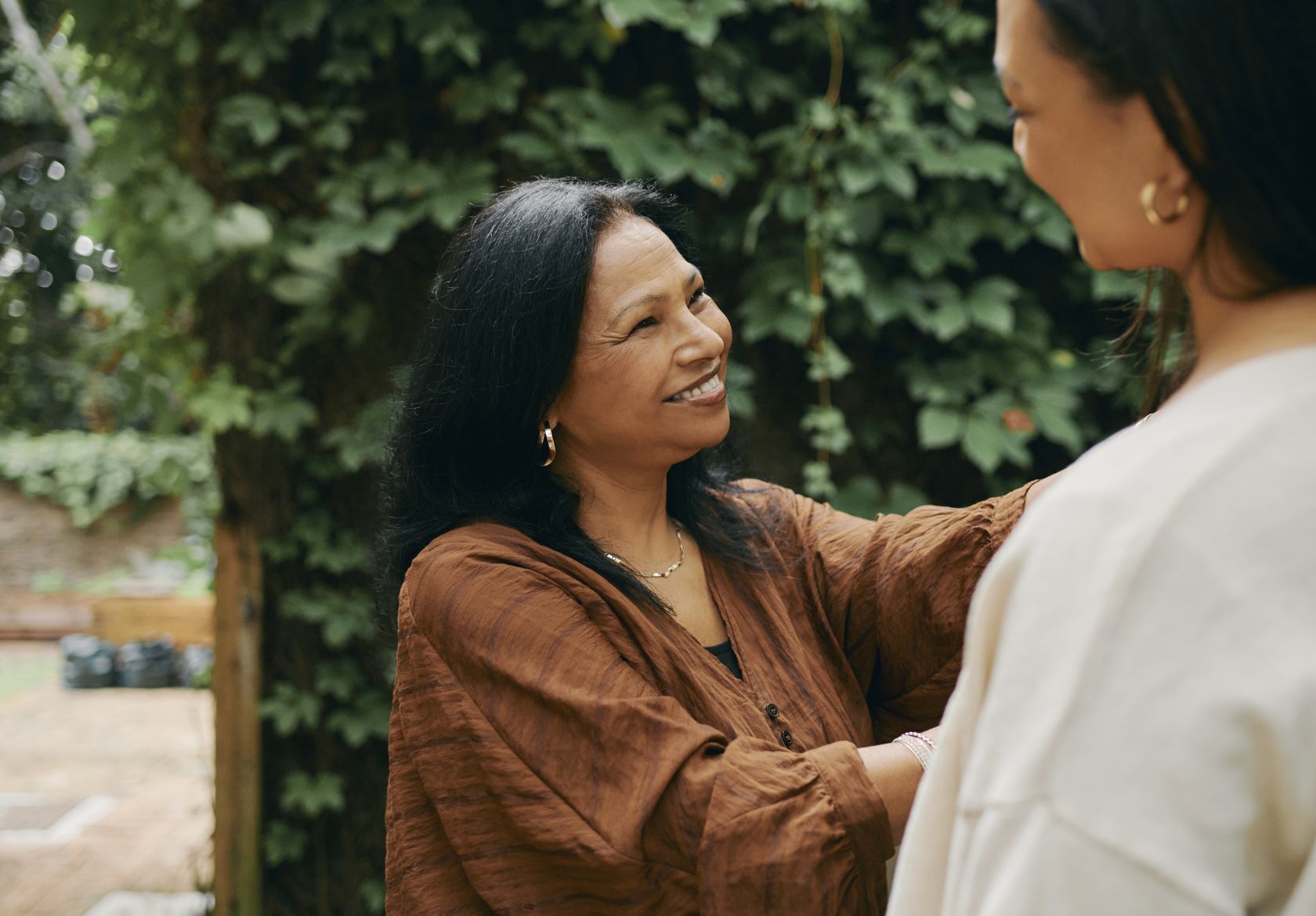 Woman smiling at another woman