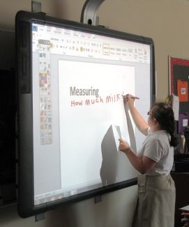 Student writing on Promethean Board