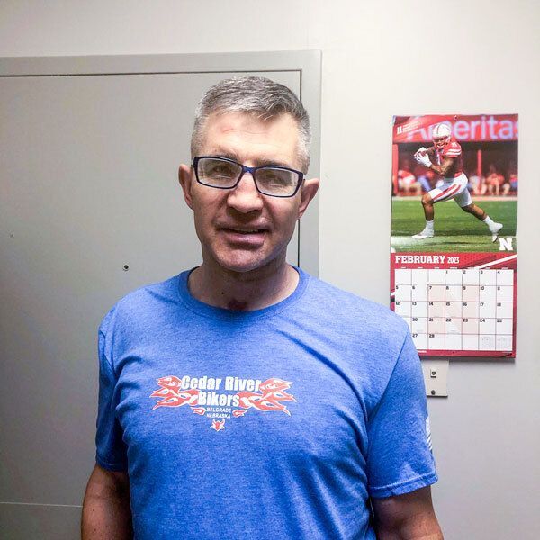 Photo of Jeremy (gray haired man wearing a blue t-shirt)