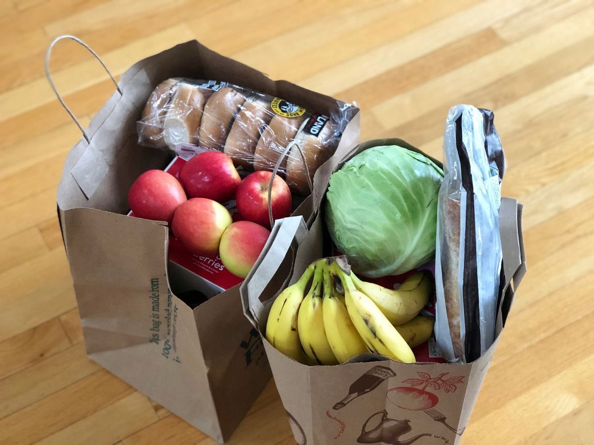 Two grocery bags of delicious food