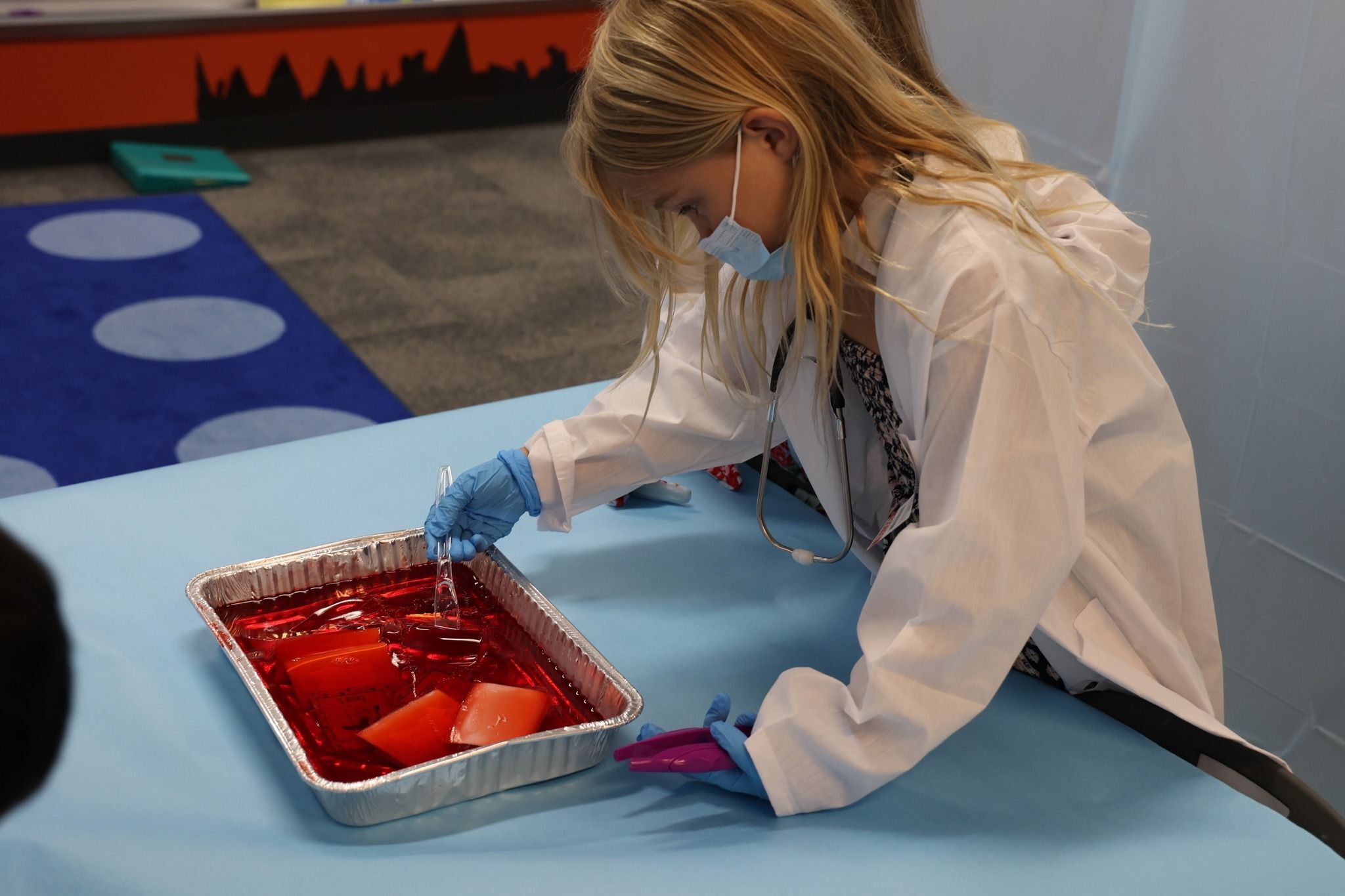 Anchor Point student reviews latest reading unit in body systems by participating in the schools Doctors in 1st Grade activity.