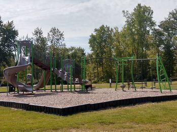 Brown and green playground equipment.