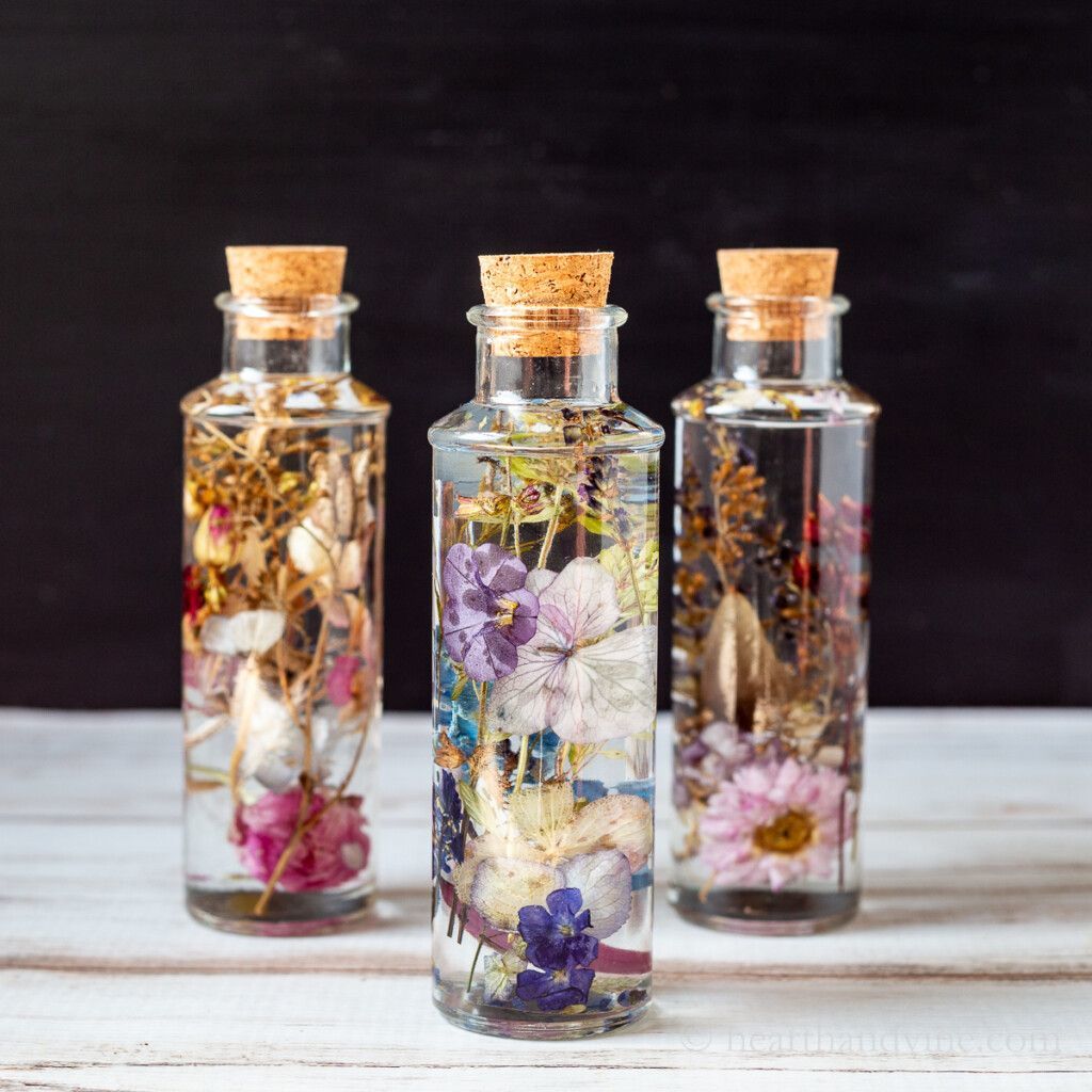 Photo of glass bottles with flowers inside. (Photo credit: Patti Estep of HearthandVine.com)