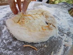 Preparing pizza dough.