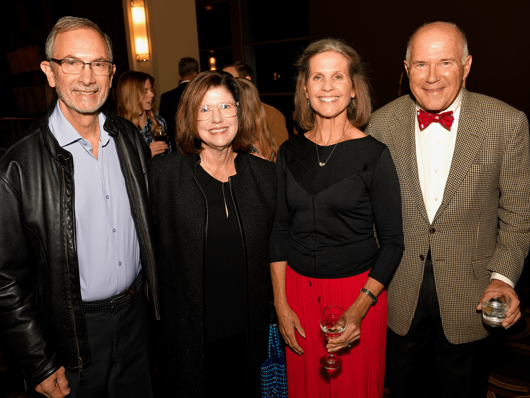 two couples at a cocktail event