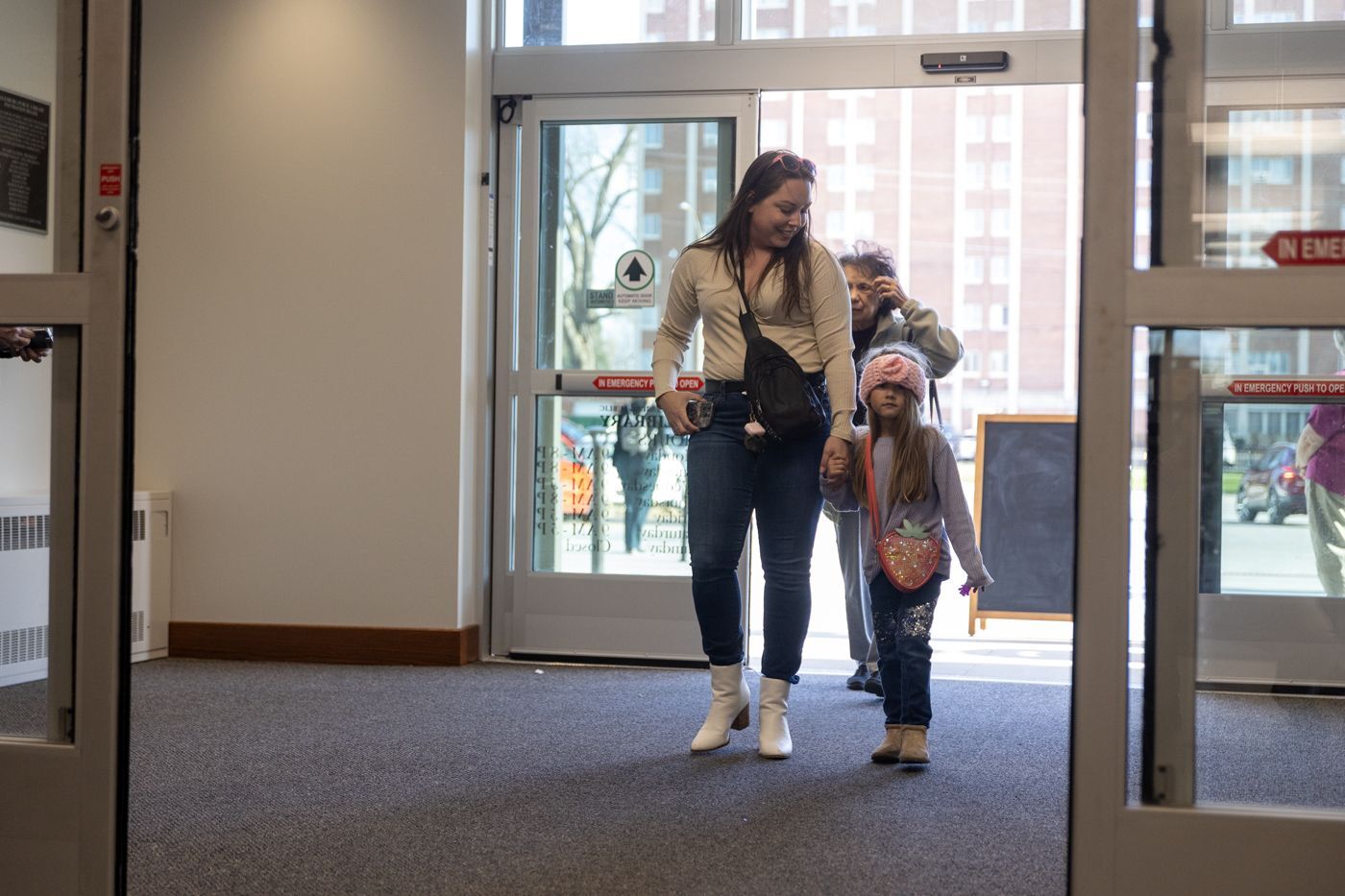 mother and child entering library