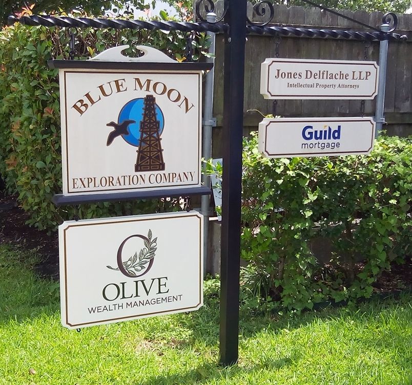 C12140 - Four Engraved HDU Commercial Signs Hung from Two Wrought Iron Scroll Brackets Mounted on a Wood Post