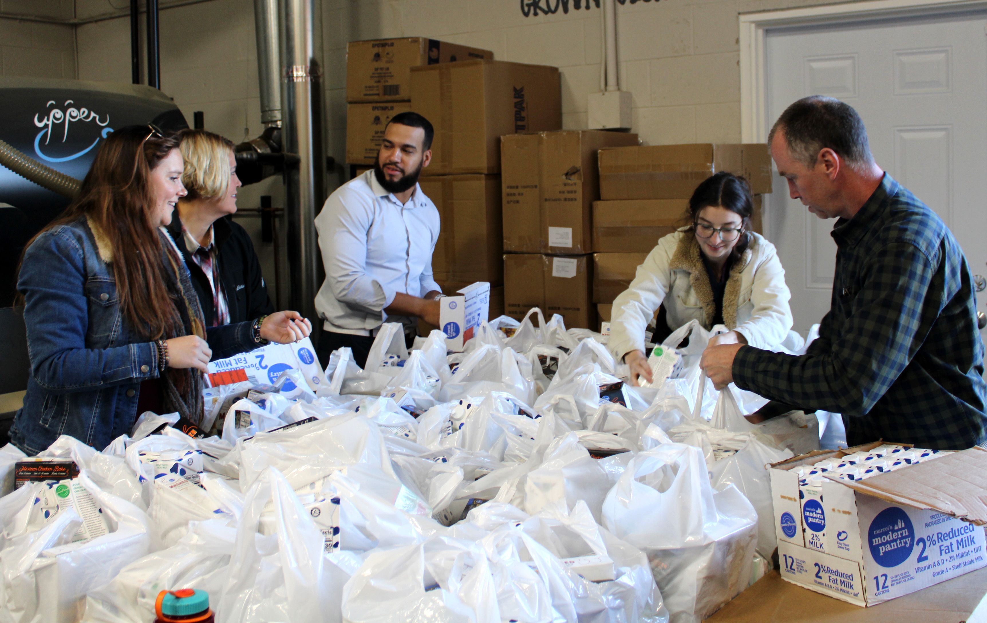 Home for Families volunteers assemble meal kits for Columbus area families experiencing housing instability