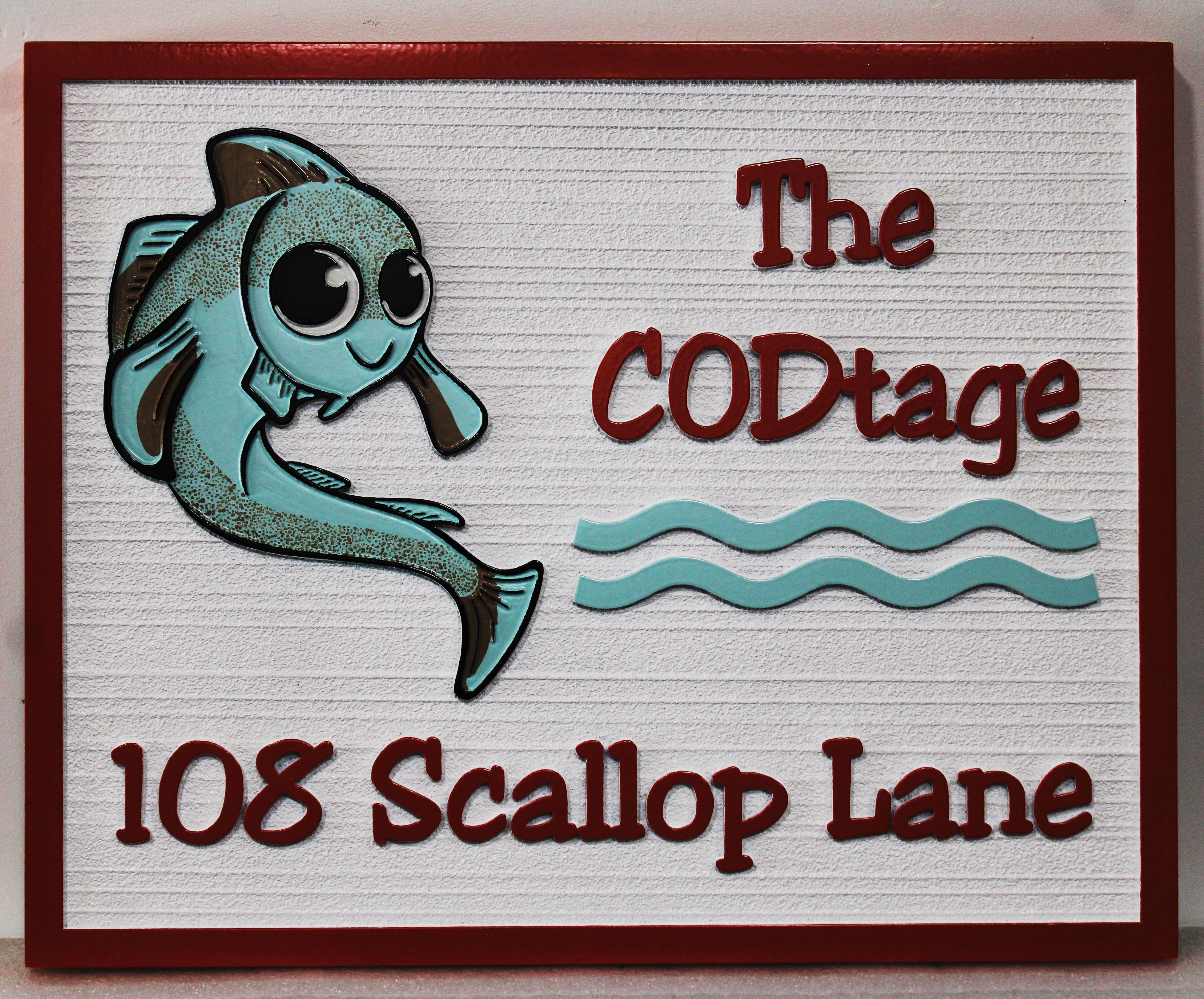 L21394  - Carved R2.50D Raised Relief and Sandblasted Wood Grain HDU Address Sign  for "The CODtage" for a Coastal Residence