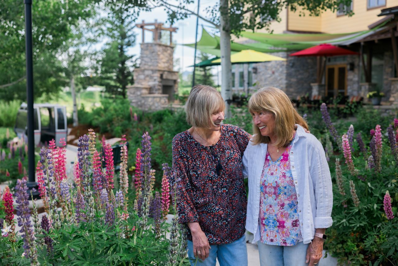 Two happy women in garden at Casey's Pond in Steamboat Springs, CO