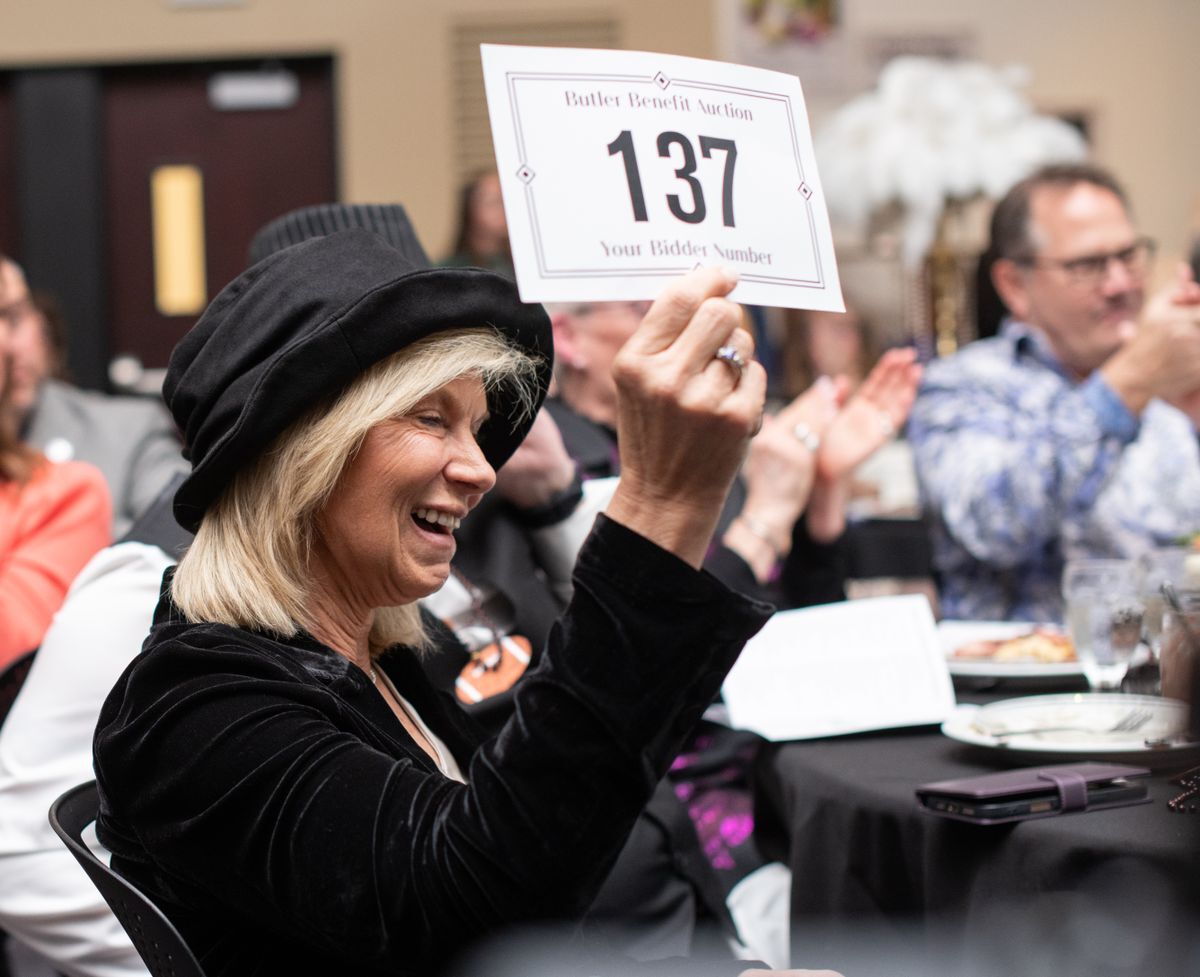 Dr. Daniel bids on a live auction item